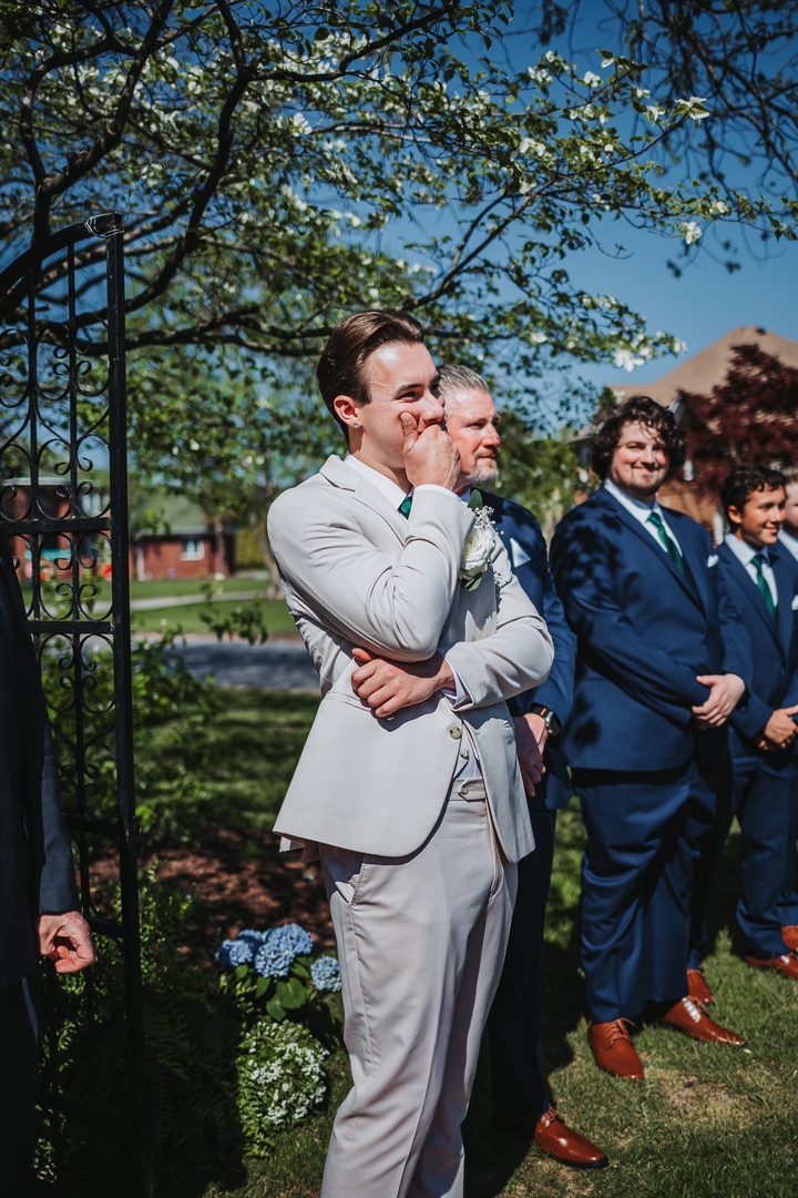 Max waiting in the garden as the ceremony begins