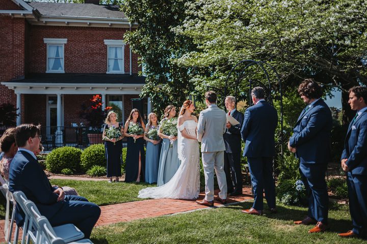 Brooke and Max exchanging vows in front of the Manor