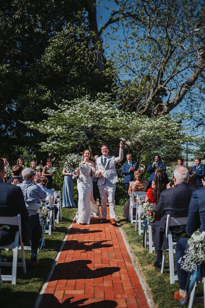Brooke and Max walking back down the aisle together