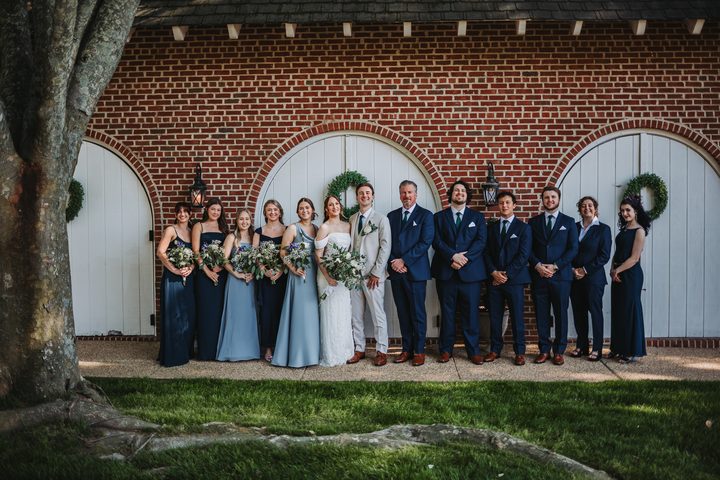 The wedding party lined up outside the Carriage House