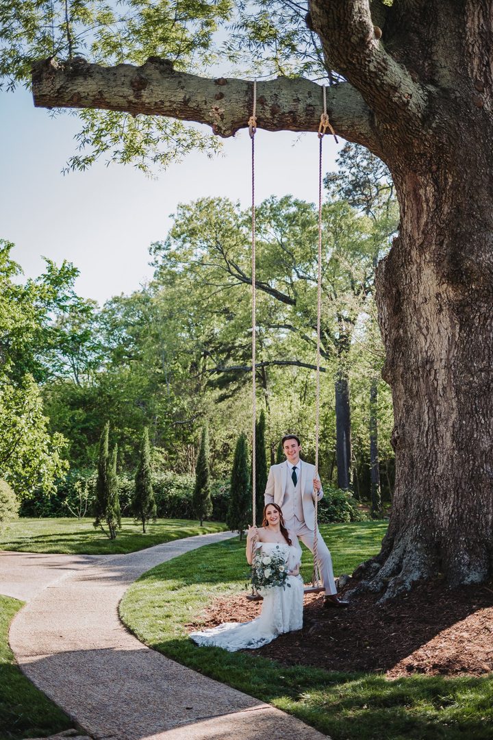 Brooke and Max beneath the oak’s branches beside the garden swing
