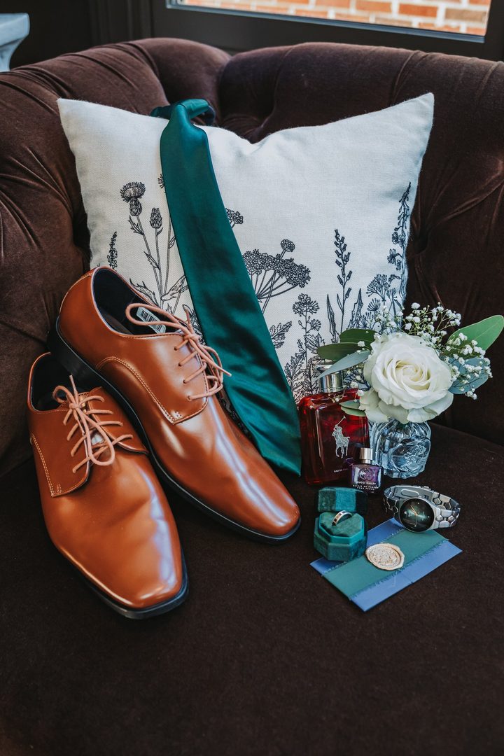 Max’s shoes, green tie, boutonniere, and wedding-day details