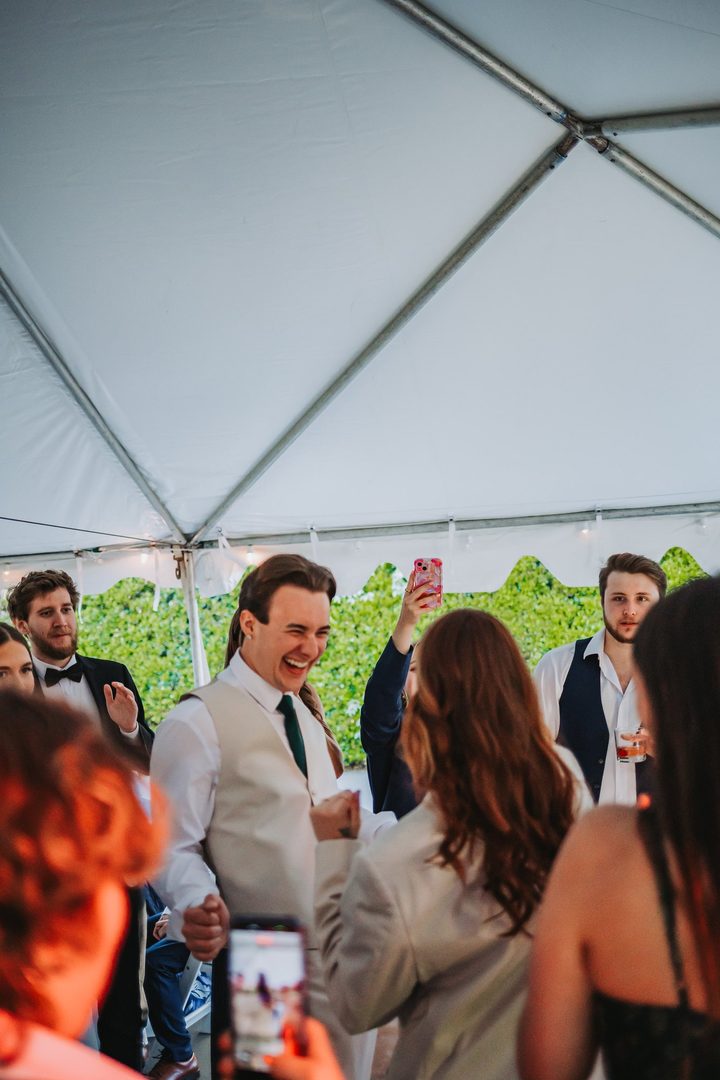 Brooke and Max sharing a laugh with their wedding guests