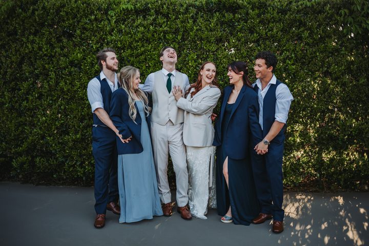 Brooke and Max with friends beside the garden greenery