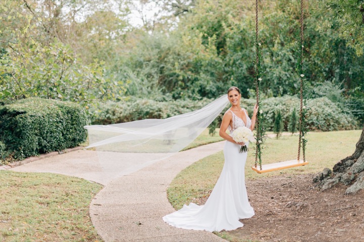 Sarah’s veil blowing beside the old oak and garden path