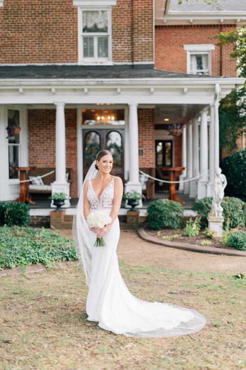 Sarah posing on the lawn in front of the Manor porch