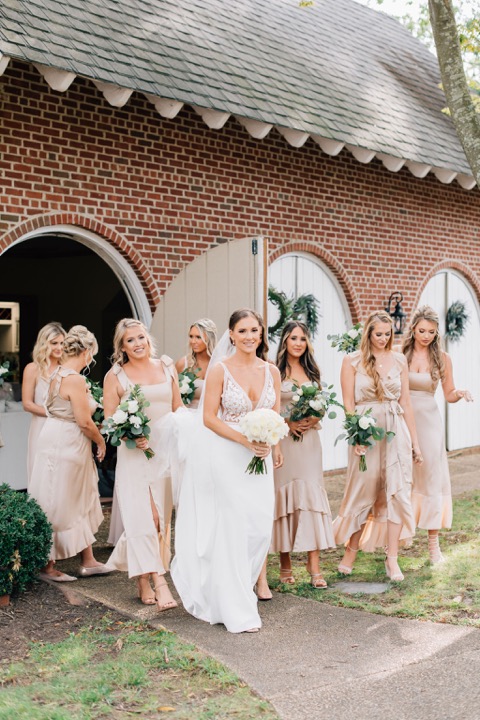 The bridal party standing outside the Carriage House