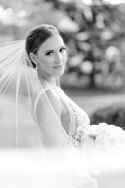 A black-and-white portrait of Sarah beneath her veil
