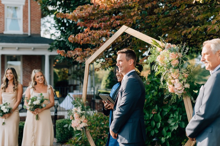 The groom speaking during the garden ceremony