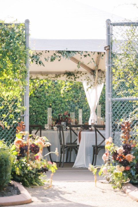 Autumn flowers framing the garden entrance to the reception