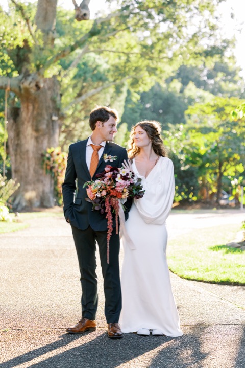 Madelynne and Parker together beneath the garden trees