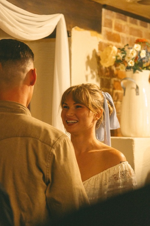 Kali smiling at Casey during their indoor ceremony