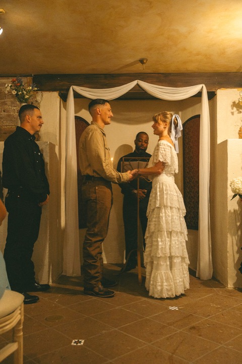 Casey and Kali exchanging vows in the Cellars