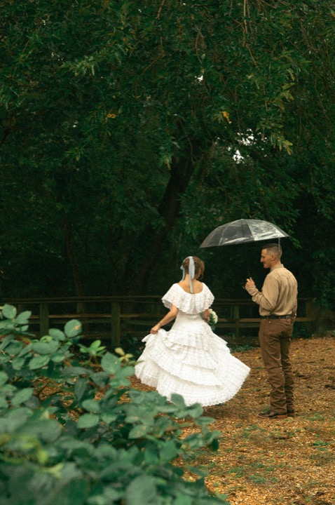 Casey and Kali dancing on the garden path in the rain