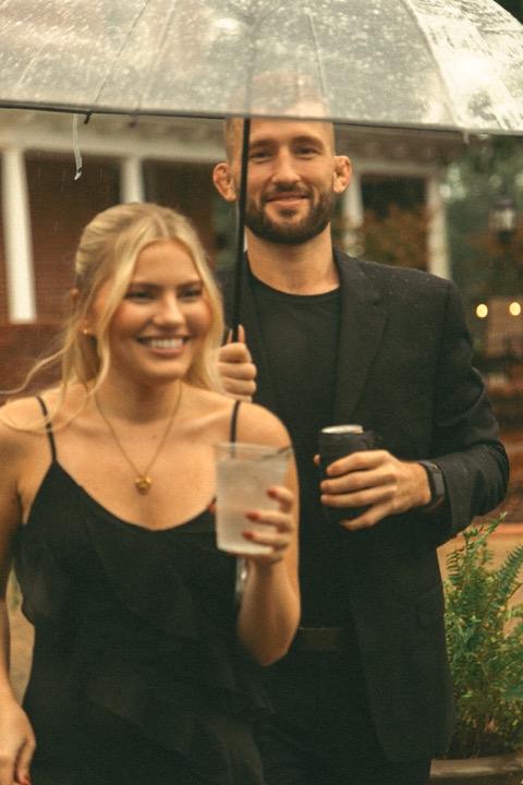 Wedding guests smiling together at the reception