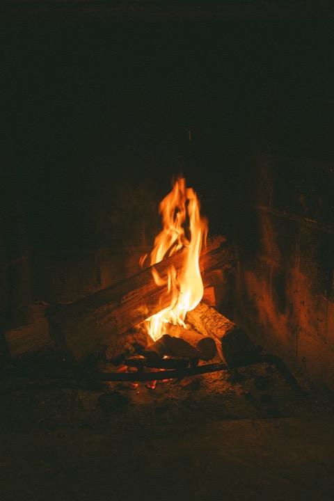 A fire glowing in the Cellars fireplace