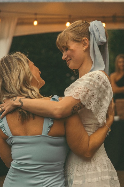 Kali sharing an embrace during the reception