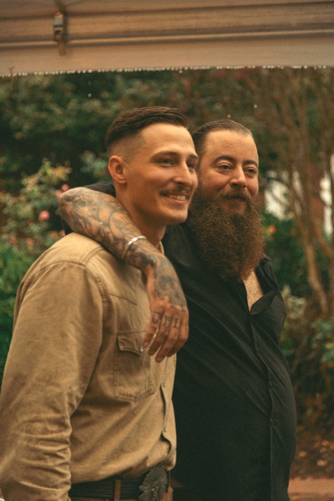 Casey laughing with a guest outside the Manor