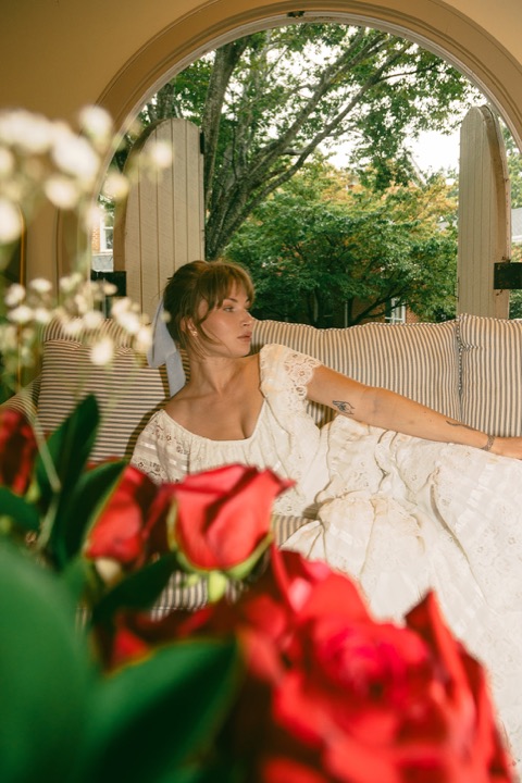 Kali sitting on the Manor porch before the celebration