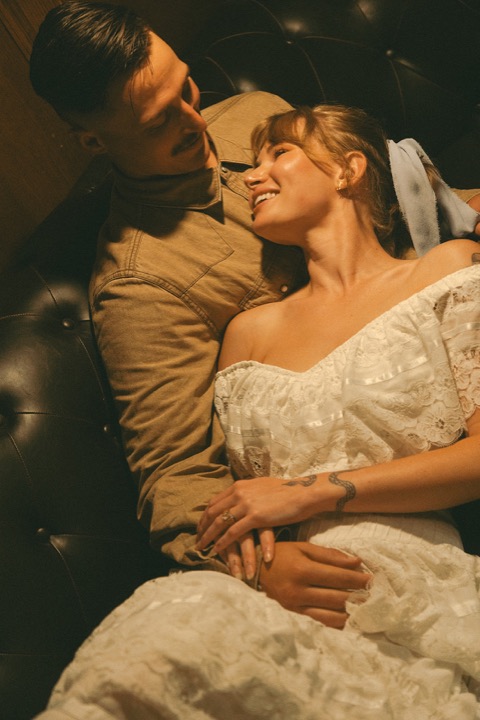 Casey kissing Kali on the cheek in the Cellars