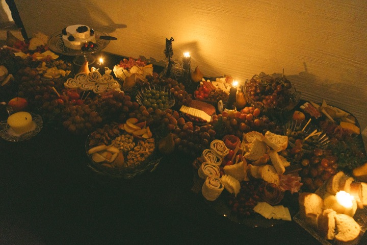 Candles and flowers arranged for the intimate indoor ceremony