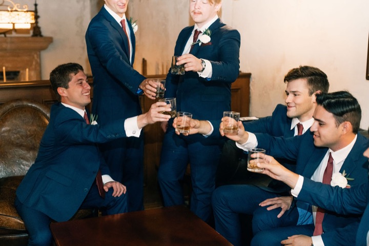 Tyler and his friends raising glasses in the Cellars