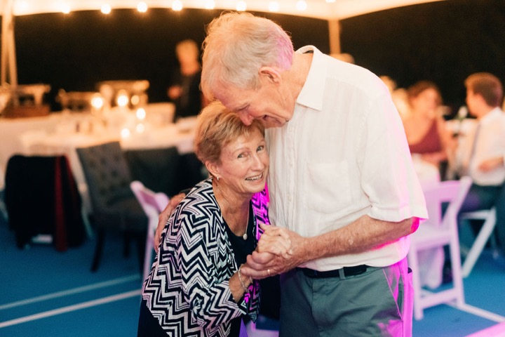 Wedding guests sharing a dance together