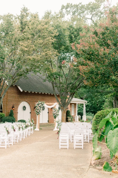 The garden aisle leading to the floral ceremony arbor