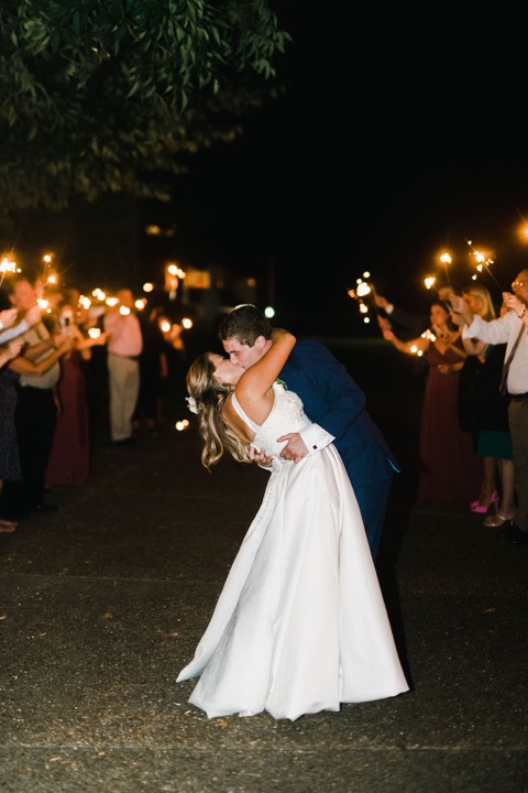 Tyler and Kate sharing a dip during their sparkler farewell