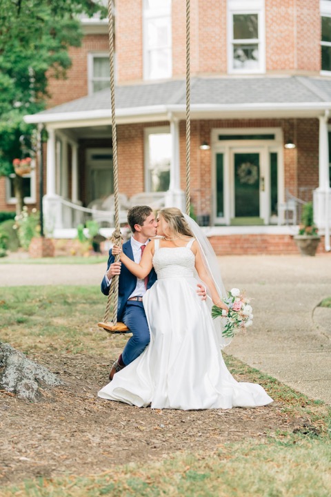 Tyler and Kate together on the lawn in front of the Manor