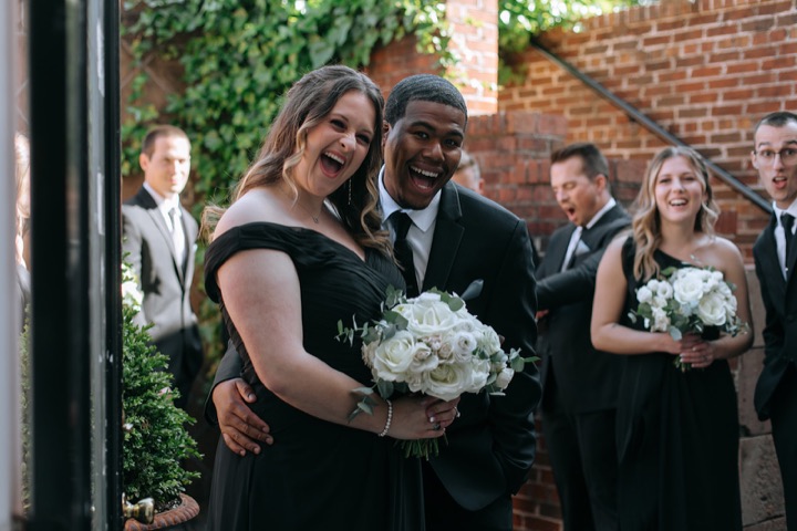 Guests smiling together after the ceremony