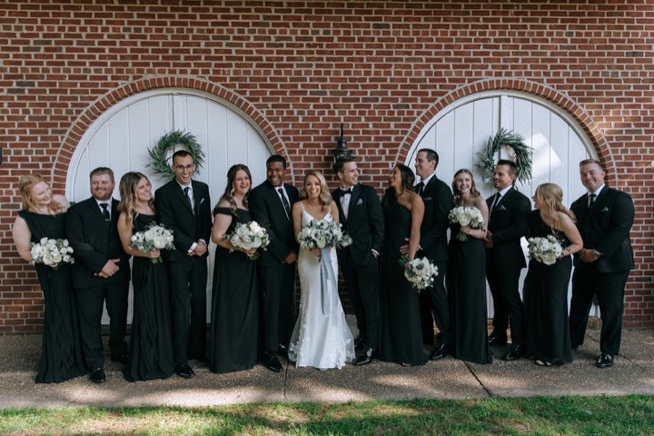The wedding party gathered outside the Carriage House
