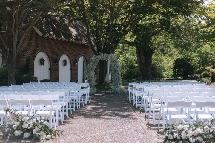 The ceremony aisle leading toward the Carriage House