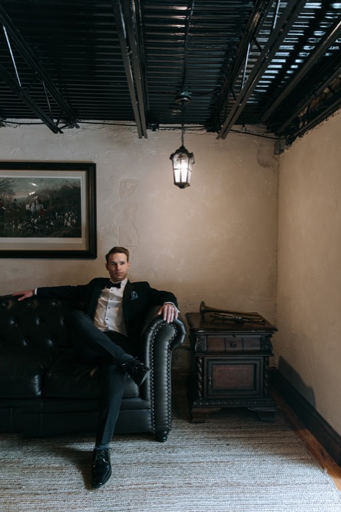 John relaxing in a vintage lounge chair in the Cellars