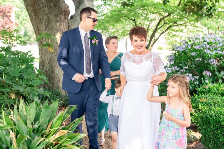 Dave and Leslie enjoying a moment with young wedding guests