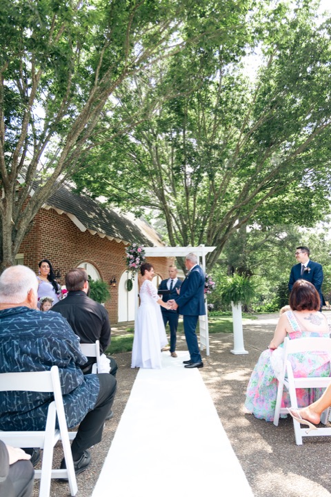 The wedding ceremony in the shaded garden