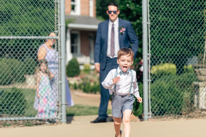A young guest playing near the reception tent