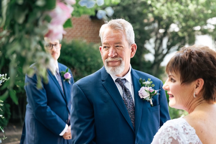 Dave smiling at Leslie during the ceremony