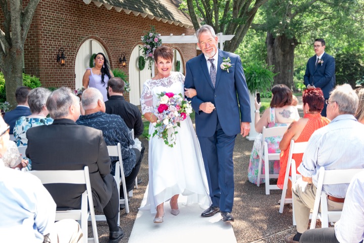 Dave and Leslie walking up the aisle after the ceremony