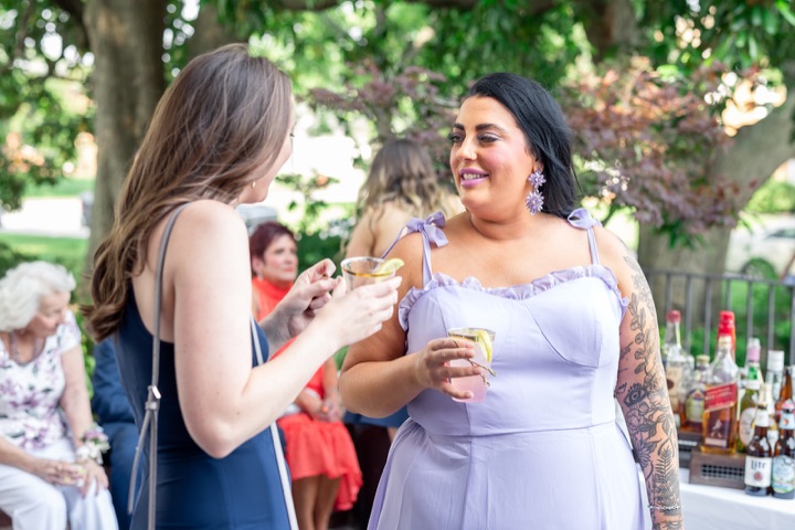 Wedding guests chatting together in the garden