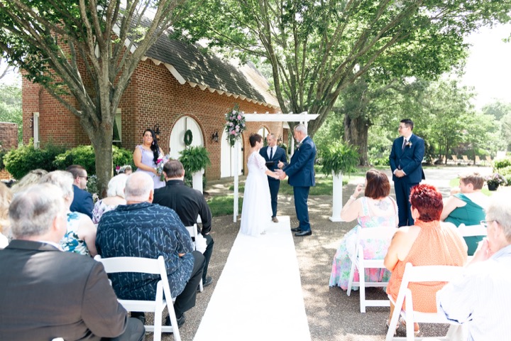 A view down the aisle as the garden ceremony begins